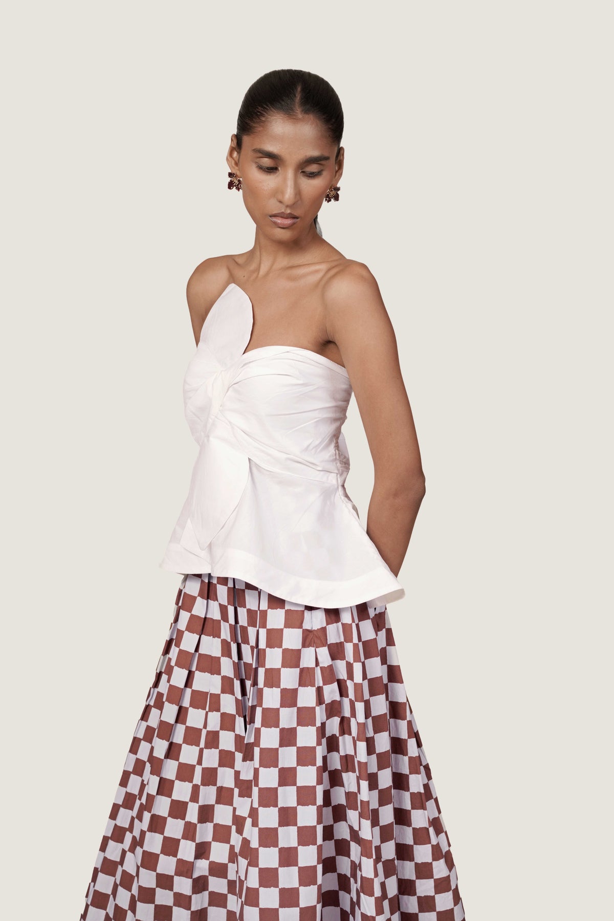 BOW WHITE TOP WITH PLEATED CHECKERED SKIRT CORD SET